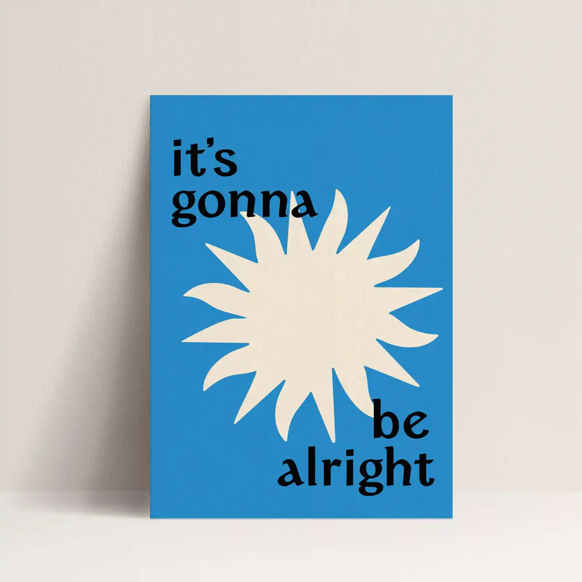 Affiche à message "It's gonna be alright" de papier and co représentant un soleil blanc sur fond bleu